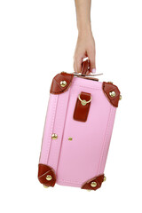 Travel concept. Female hand holding a pink suitcase isolated on white transparent background, PNG