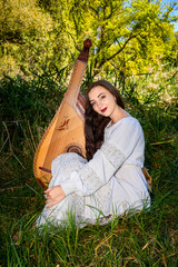 Young Ukrainian woman in a white dress and with flowing hair