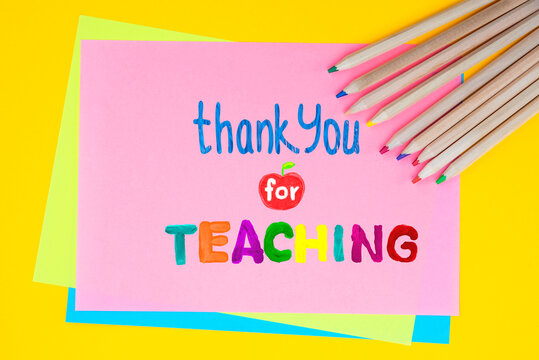 Childish lettering for Teachers' Day. Appreciation of teachers top view flat lay concept. Colored paper, multi-coloured letters, supplies