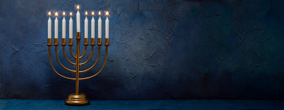 Jewish Hanukkah Menorah 9 Branch Candlestick. Holiday Candle Holder. Nine-arm candlestick. Traditional Hebrew Festival of Lights candelabra. Background for design with copy space