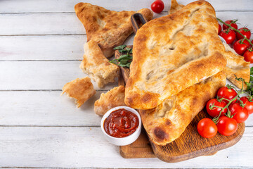Shotis puri, handmade Georgian bread lavash, local national Caucasian Central Asian food, fresh baked Shoti bread