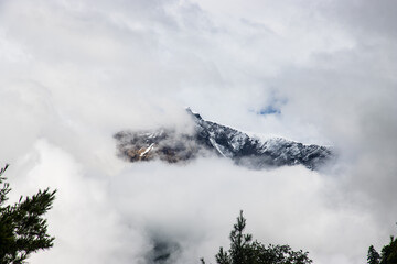Dark and Dramatic Himalaya Mountain in the Clouds Hidden by Fog in Nepal