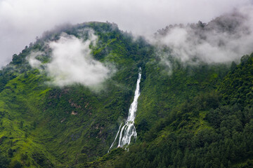 Beautiful Waterfall in the Green Hill Mountain  during Monsoon in Tatopani, Nepal