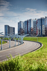 Empty expressway of the western high-speed diameter in st. petersburg in clear sunny weather, green...