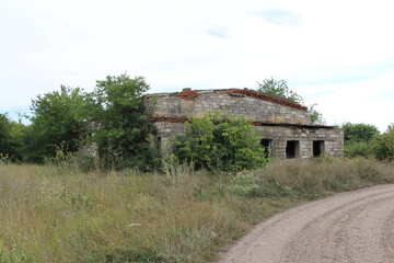 A building with windows and trees in front of it