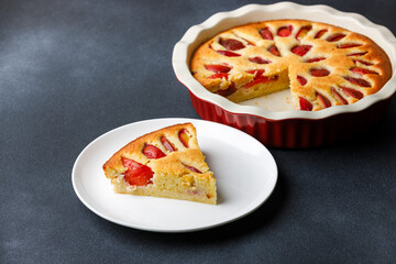Homemade plum pie with almond flour with a piece served on plate
