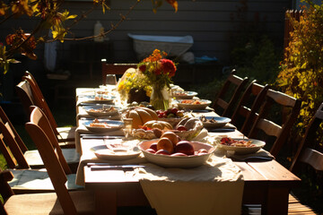 Autumn celebration with roasted chicken and candle-lit dinner table.