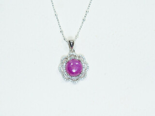 Silver jewelry and gemstone on white background