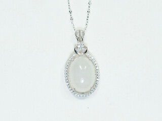 Silver jewelry and gemstone on white background