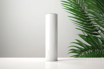 A mock-up white tube for cream on the background of palm leaves