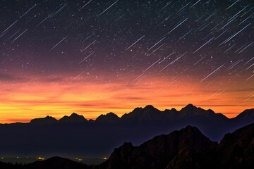 perseid meteors over silhouetted mountain range