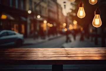 Foto op Canvas The blurry shop window of a cafe is adorned with a wooden table top and a light bulb. It serves as the perfect background for creating a montage of product displays or a key visual design. © 2rogan