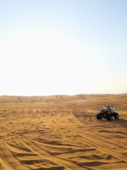 picture of the dubai desert with a quad to the right - for travelling related topics and more