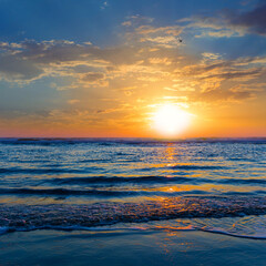 Fototapeta premium calm sea coast at the early morning, sea beach at the sunrise