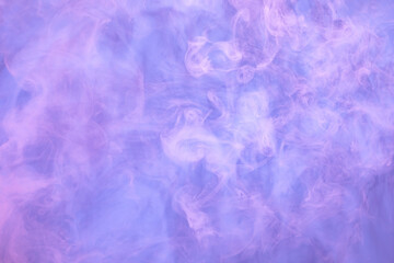 Fototapeta na wymiar Pink and purple smoke on light blue background. Soft smoke texture