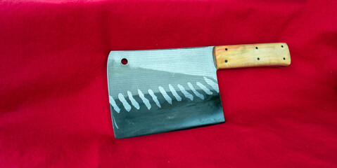 A stout rectangular meat cleaver cutting instrument