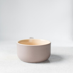 cream and mauve ramekin with a handle, flat lay of an oven safe ramekin for baking
