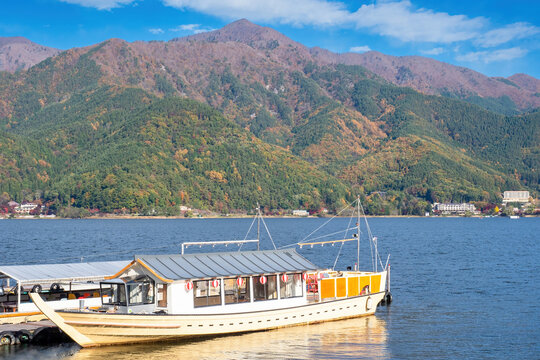 Nature of Japan. Lake kawaguchiko. Passenger port near pier. High mountains near lake. Japanese landscape. Tour of Japan. Kawaguchiko on summer day. Porom excursions in Japan. Kawaguchiko landscape