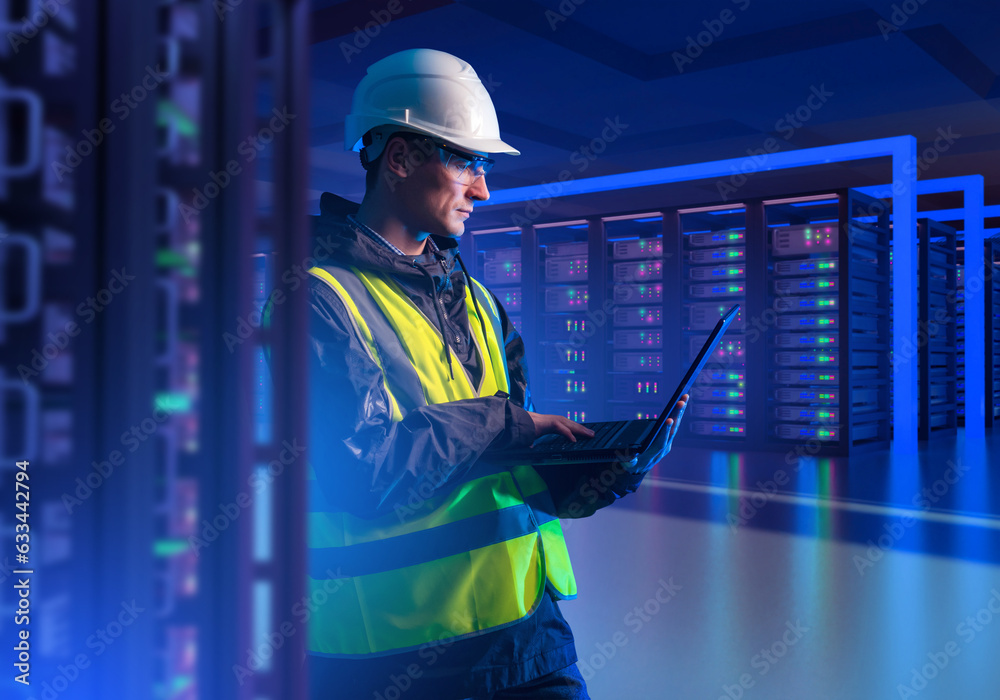 Poster man in server room. hosting provider engineer. programmer with laptop. guy is setting up server hard