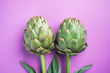 Fototapeta premium Top view of artichoke vegetables on pastel violet background