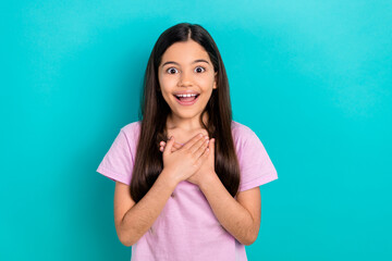 Photo of impressed funky small kid wear pink t-shirt arms chest open mouth isolated turquoise color background