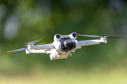 Poznan, Poland, 10 August 2023: DJI Mini 3 Pro drone in flight. Selective focus 