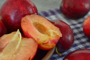 Fototapeta na wymiar delicious juicy plums on the table