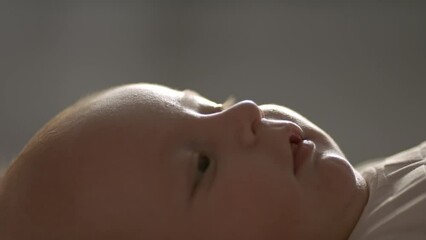 Newborn baby is laughing. Happy baby. 