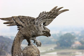 statue of eagle in landscape, Vietnam
