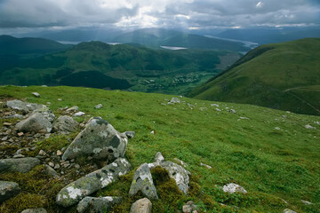 Fototapeta na wymiar Lichen-covered rocks dot the mountain landscape near Ben Nevis; Scotland