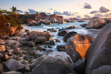 Scenic view of the large, boulders on the seaside shores of The Baths at twilight, a famous beach...