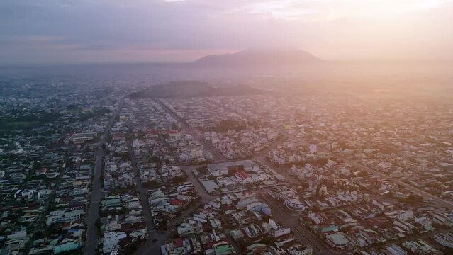 Aerial view of Long Hoa market, a famous market at Tay Ninh city, Vietnam, far away is Ba Den mountain in the morning