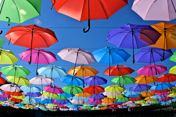 Fototapeta na wymiar Colorful parasols and blue sky