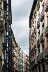Obraz premium Apartments buildings lining street of Bilbao old town in Spain