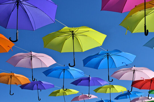 View up at pastel colored parasols