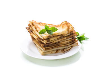 lot of pancakes thin pancakes in a plate, on white background.