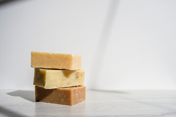 Stack of handmade soap with a white background.