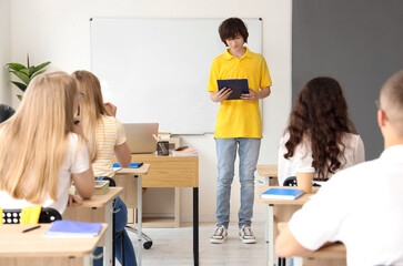 Group of students having lesson in classroom