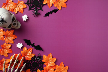 Happy Halloween holiday concept. Flat lay composition with Halloween decorations, skull, pumpkins,...