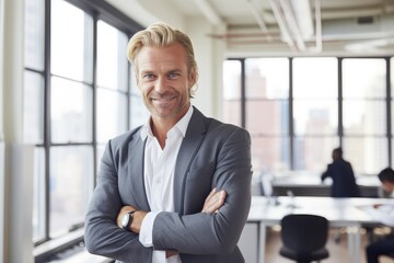 Middle aged scandinavian businessman smiling in the office