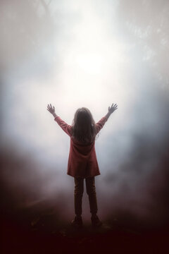 a young girl praising the lord. arms raised to the sky. god's rays of light shining down. 