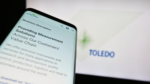 Stuttgart, Germany - 08-04-2023: Mobile phone with webpage of company Mettler-Toledo International Inc. on screen in front of business logo. Focus on top-left of phone display.