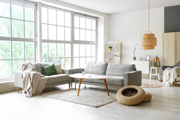 Interior of light living room with sofas and coffee table
