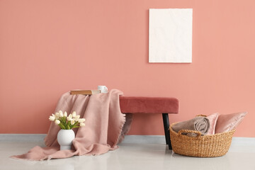 Fototapeta na wymiar Interior of stylish living room with plaid on soft bench