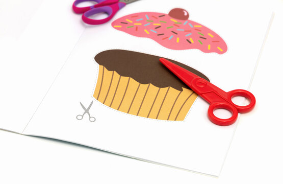  Child development concept. Peper cut out picture for kids with scissors. High quality photo