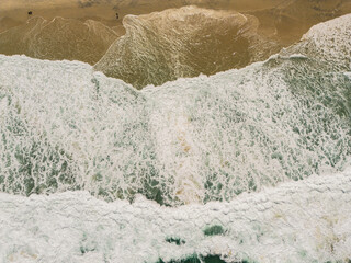 Sand,  ocean and people.