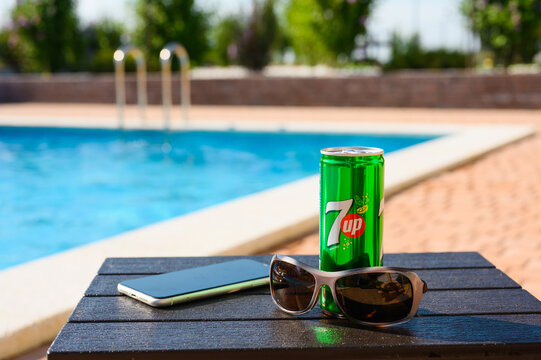 Anapa, Russia - July 18, 2023: Relaxing by the pool with 7up soft drink