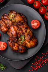 Delicious baked chicken meat with salt, spices and herbs