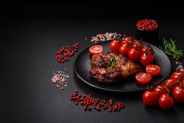 Delicious baked chicken meat with salt, spices and herbs