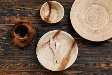 Different tableware on wooden background